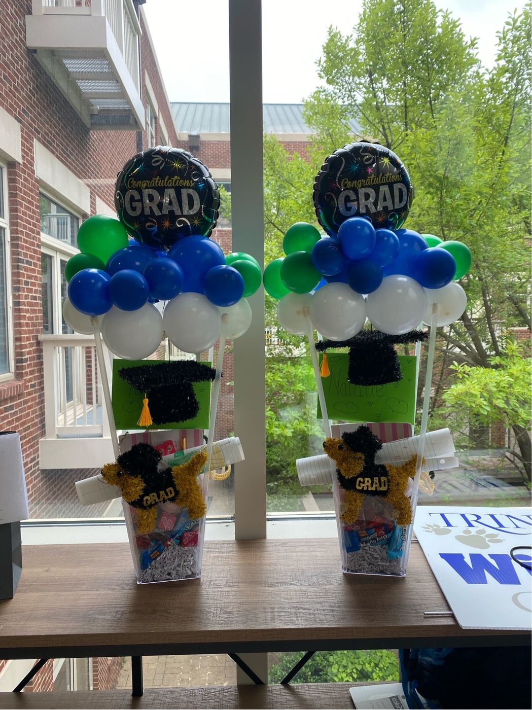 Graduation centerpieces with balloons in school colors